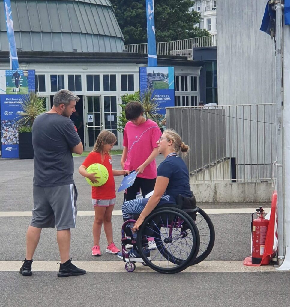 Abbie Breakwell talks to young fans after her first match